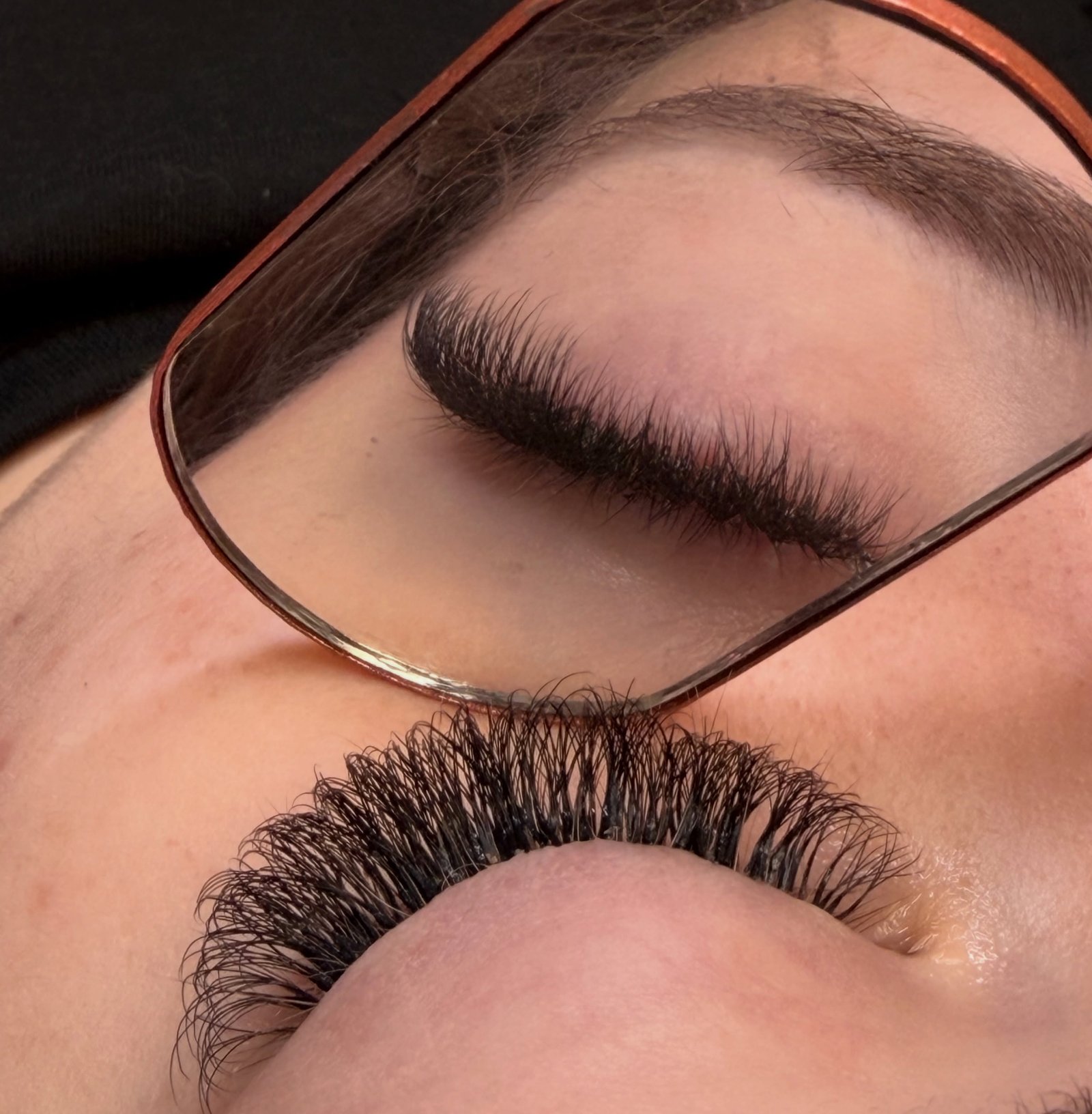 Eyelash extension result reflected in a mirror